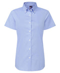 A light blue, short-sleeve shirt button-up with a collar and white buttons is shown on a plain white background.