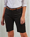 Person wearing a checked shirt, brown belt, and Premier PR572 shorts.