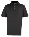 The Premier PR610, a sleek black short-sleeve polo shirt featuring a collar and three buttons, is showcased against a white background.