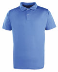 The PR612 by Premier is a plain blue polo shirt featuring short sleeves, a collar, and three buttons on the front.