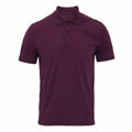 The Premier PR615 is a plain dark purple polo shirt featuring a folded collar and three buttons.