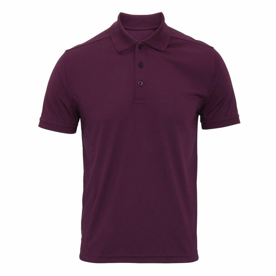 The Premier PR615 is a plain dark purple polo shirt featuring a folded collar and three buttons.