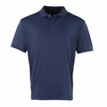 The Premier PR615 is a plain navy blue polo shirt featuring short sleeves and a buttoned collar, made of smooth and lightweight fabric. It is showcased against a white background.