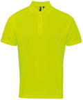 A vibrant yellow polo shirt featuring a collar and three front buttons from Premier, known as the PR615.