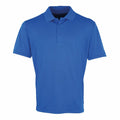 The Premier PR615 is a relaxed fit polo shirt in plain blue, featuring a collar, three buttons down the front, and short sleeves.