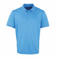 The Premier PR615 is a plain blue polo shirt with short sleeves and a collar, featuring three buttons down the front, displayed against a white background.