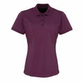 Product Description: The Premier PR616 is a maroon short-sleeve polo shirt featuring a three-button placket and a flat collar, set against a white background.