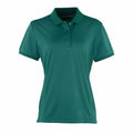 Premier's PR616 is a teal short-sleeve polo shirt featuring a collar and buttons.