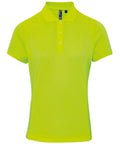 A vibrant yellow Premier PR616 short-sleeved polo shirt, featuring a collar and three front buttons, is showcased against a simple white background.