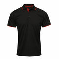 The Premier PR618 is a black polo shirt with red trim on the collar and sleeves. It features a button-up neckline with two visible buttons, displayed against a white background.