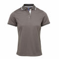 The Premier PR619 is a gray polo shirt featuring a three-button placket and short sleeves, with thin white trim accentuating the collar and sleeve cuffs. The fabric is smooth and slightly fitted, making it ideal for both casual and semi-formal occasions.