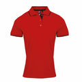 Premier's PR619 is a red polo shirt with black trim on the collar and sleeves, featuring a three-button placket. The shirt is displayed against a plain white background.