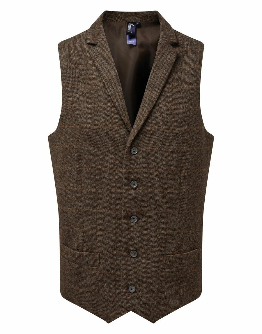 Premier's PR625 is a brown plaid waistcoat featuring five buttons and two front pockets.