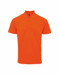 The Premier PR630 is a vibrant orange short-sleeve polo shirt featuring a collar and three buttons running down the front. It is showcased against a plain white background.