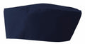 The Premier PR653 chef hat is navy blue with a flat top and cylindrical shape, commonly used in professional kitchens. The fabric is thick and durable, making it ideal for culinary use.