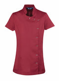 Premier PR682 chef's jacket in red features short sleeves, a mandarin collar, and an asymmetrical button closure on the right side.