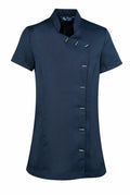 The PR682 by Premier is a short-sleeved uniform top in dark blue, featuring a high collar and an asymmetrical button closure. The buttons create a diagonal line down the front, adding a distinctive touch to the design.