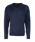 A plain navy blue V-neck sweater with long sleeves, labeled as product PR694 by Premier, displayed against a white background.