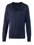 Premier's PR696 is a navy blue V-neck sweater with long sleeves, presented against a white background.