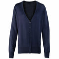 The Premier PR697 is a navy blue cardigan featuring long sleeves and a deep V-neck. It has a button-up front with five matching buttons and is crafted from soft, lightweight material, making it perfect for layering.