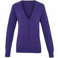 The Premier PR697 is a cardigan in purple, featuring long sleeves and a V-neckline. It is designed with a button-down front, complete with matching purple buttons, and has ribbed cuffs and hem for added style.