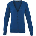 The PR697 by Premier is a blue V-neck cardigan featuring long sleeves and a button-up front. The fabric is soft, offering a classic and versatile style.
