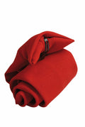 A neatly folded Premier PR710 necktie in red with a glossy finish, secured with a metal tie clip.