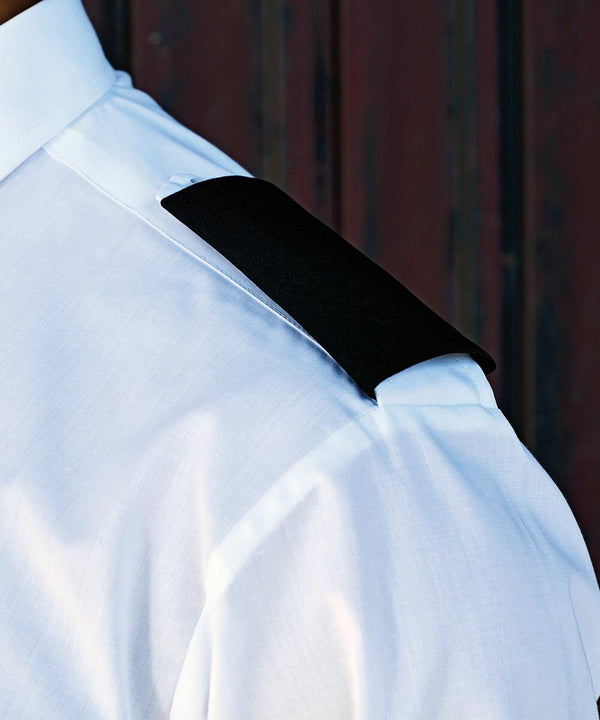 Close-up of a person's shoulder wearing a Premier PR715 white shirt with a black shoulder epaulet.