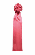 A vibrant pink silk scarf from Premier, model PR730, tied in an elegant knot with a long tail hanging down. The smooth and glossy fabric reflects light gently.