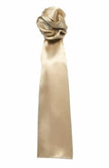 A luxurious PR730 satin scrunchie in light gold, featuring a long and flowing ribbon tail, is showcased against a white background by the brand Premier.