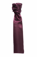 The Premier PR730, a deep burgundy silk cravat with a glossy finish, is tied in a loose knot to accentuate its elegant and smooth texture.
