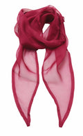 The Premier PR740 scarf, in sheer burgundy, is showcased against a white backdrop. It boasts a lightweight, translucent texture with pointed ends, exuding an elegant and flowing appearance.