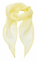 The Premier PR740 is a light yellow silk scarf featuring a delicate, sheer texture. It has a triangular shape with pointed ends and is designed to be softly draped, emphasizing its translucent quality.