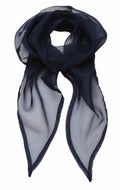 The Premier PR740 is a sheer, dark blue scarf featuring a subtle sheen, elegantly designed in a circular drape. Its edges are slightly darker to enhance the depth of the translucent fabric.