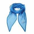 The PR740 sheer blue scarf by Premier is neatly folded, with its ends hanging symmetrically against a white background, showcasing its light and airy fabric that is perfect for a stylish accessory.