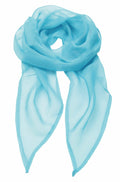 The Premier PR740 scarf, in a light blue sheer chiffon, is gracefully arranged against a white background. The fabric is lightweight and translucent, featuring elegantly flowing ends.