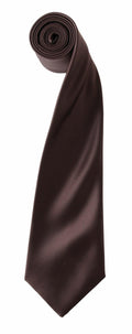 A neatly rolled tie, featuring a smooth texture and subtle sheen indicative of its high-quality material, is displayed vertically with the narrow end at the top and the wide end hanging down. This elegant brown silk tie is the PR750 from Premier.