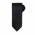 A Premier necktie, model PR781, in black with small red polka dots, neatly rolled at the end.