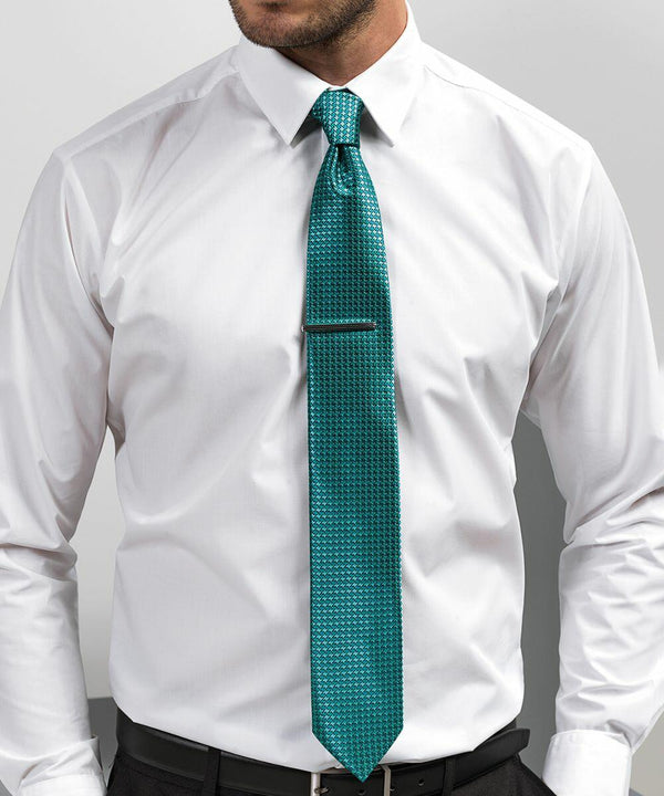 A person wearing a white Premier PR787 dress shirt and a teal tie with a subtle patterned design.