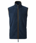 The Premier PR803 is a sleeveless navy blue fleece vest featuring a front zipper and brown piping along the edges. This vest includes a high collar and is crafted from soft material.