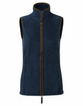 The Premier PR804 is a sleeveless fleece vest in navy blue, featuring a high collar and front zipper. It includes two side pockets and has brown edging along the zipper and armholes.