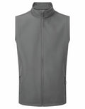 The Premier PR814 is a gray vest featuring a sleeveless design, a full front zipper, and two zippered side pockets.