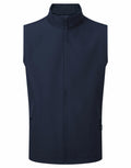Featured is the PR814, a navy blue zip-up sleeveless vest with a high collar from the Premier brand, displayed laid flat.