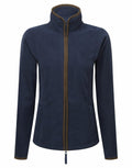 The Premier PR824 is a navy blue zip-up fleece jacket featuring a high collar and brown trim. It includes two front pockets and long sleeves, all showcased against a white background.