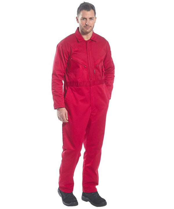 A man in a PW065 by Portwest and black shoes posing against a plain white background.