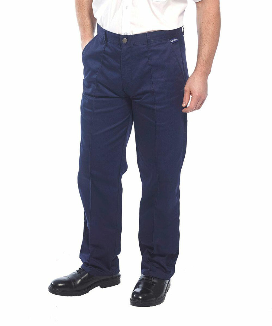 A person wearing navy blue Portwest PW105 pants and a white shirt, standing with hands in their pockets. The pants are straight-legged, and the person is also wearing black shoes.