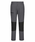The PW126 outdoor pants by Portwest feature a classic fit design ideal for hiking or outdoor activities. These gray pants boast black knee patches and include a zippered pocket on the right thigh. They are equipped with belt loops and a button closure for convenience.