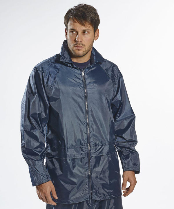 A man is wearing a dark blue, long-sleeved, zip-up PW166 rain jacket by Portwest and looking to the side.