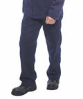Person wearing Portwest PW252 navy blue pants and a matching jacket with black shoes, standing against a white background.