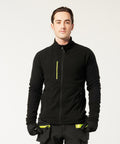 A person wearing the Portwest EV4 Textured Fleece (EV480) in black, featuring yellow-accented zip pulls and matching black gloves, stands facing forward against a plain light background.